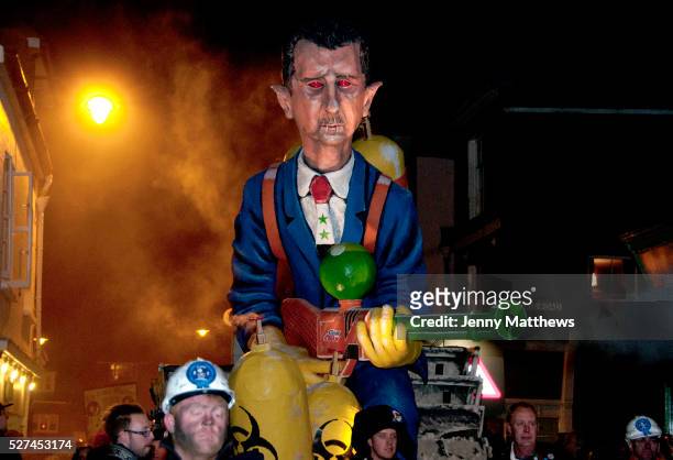 Lewes, Sussex. Bonfire Night November 5th 2013. President Assad effigy built and paraded by Cliffe Bonfire Society