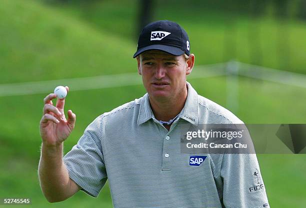 Ernie Els of South Africa shows his ball at the 16th hole during the final round of the BMW Asian Open at the Tomson Golf Club on May 2, 2005 in...