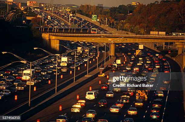 Near the junction of the 400 to Buckhead, the 401 highway divides and splits during afternoon rush-hour traffic which slows and builds up so that...