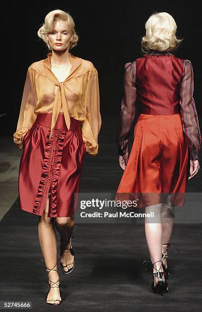 Models walk down the runway during the Jayson Brunsdon Collection show at the Cargo Hall in the Overseas Passenger Terminal during the Mercedes...