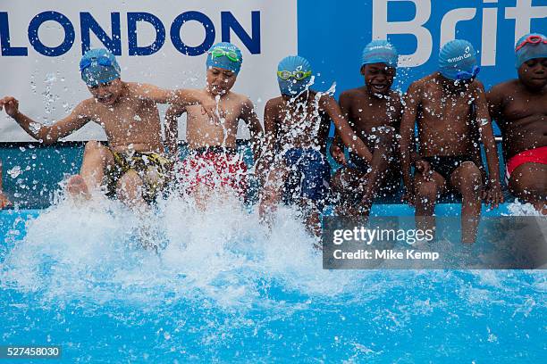 Children from Devonshire Hill Primary School in Tottenham, London, UK, take part in a 1 hour swimming session at a pop-up pool at their school to...