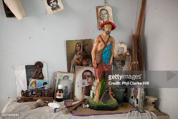 Santeria shrine in a private Cabildo. Santeria is a syncretic religion practiced in Cuba, it is a mixture of Yoruba tribal practices brought from...
