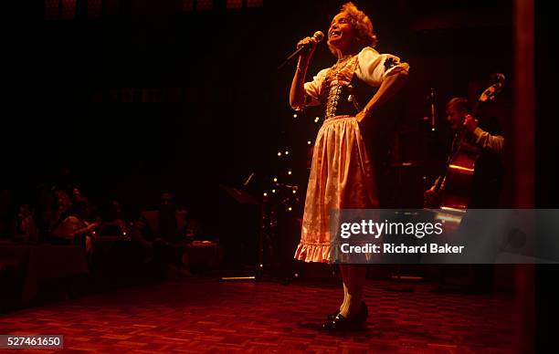 Yodelling lady singer belts out traditional Alpine Swiss songs during a concert in the Liechtenstein capital, Vaduz. In front of an audience...