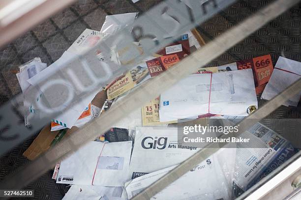 Piles of letters delivered to a closed cafe business on London's South Bank, a victim of the UK recession. The property is now vacant but post is...