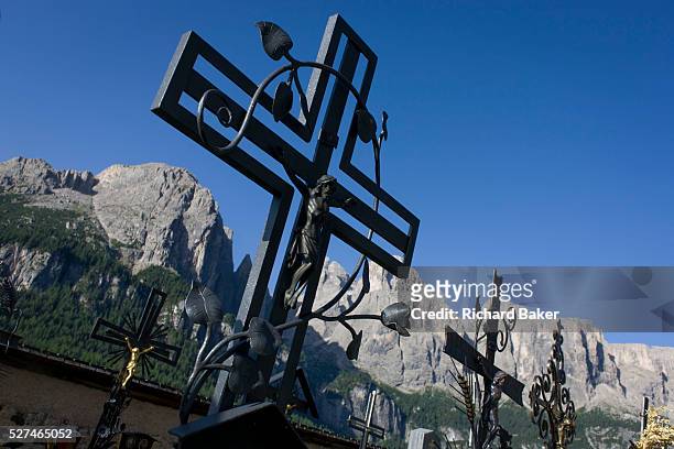 Iron crosses in the gothic churchyard of Colfosco, south Tyrol, Italy which dates back to the year 1420. The gothic church of Colfosco dates back to...