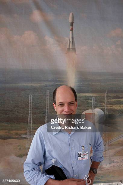 The writer, essayist and philosopher Alain de Botton stands in front of a mural of a Soyuz rocket of the Russian Federal Space Agency taking off from...
