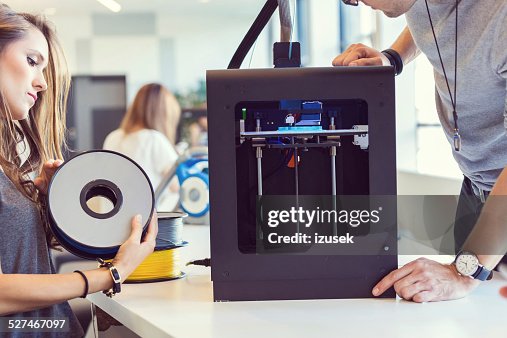 Young people using 3D printer Young people using 3D printer