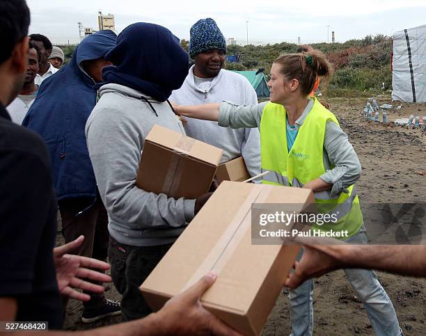 Queue for food at 'the Jungle' migrant camp in Calais, France, August 10, 2015. The Calais jungle is the nickname given to a series of camps in the...