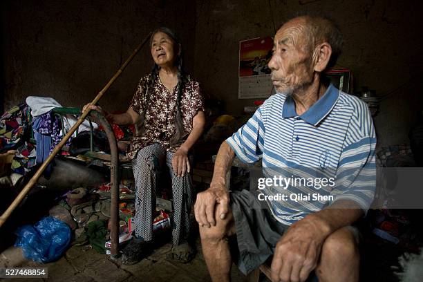 Year old Hou Guiying and her husband 81 year old Ma Jinling, sitting in their home at a rural village near Fuyang, Anhui Province, China on 28 August...