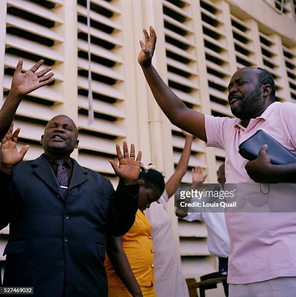Hundreds of Haitians pray at The Church of God, Rue de Centre 3, during the Sunday service The church was damaged during the earthquake with many of...