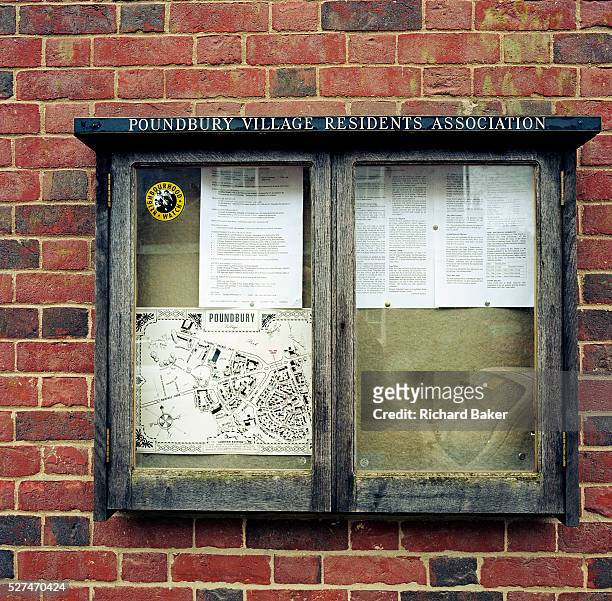 Showing a Neighbourhood Watch sticker to discourage crime, a map and various by-laws, the Resident's Association Information Board is attached to a...