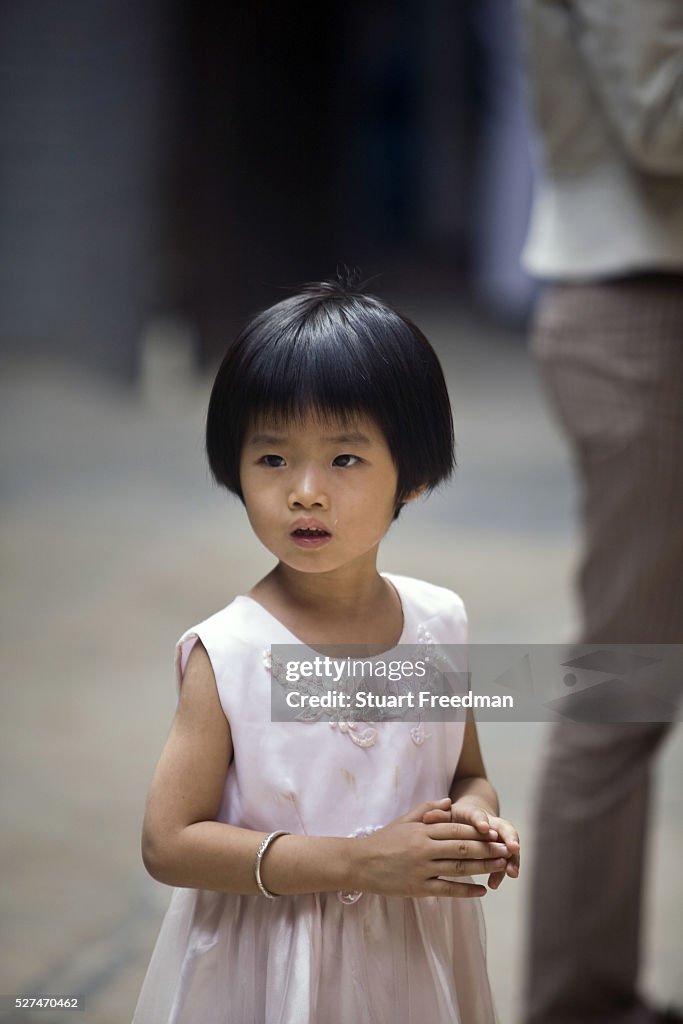 Vietnam - Ho Chi Minh City - A child at the Thien Hau Pagoda