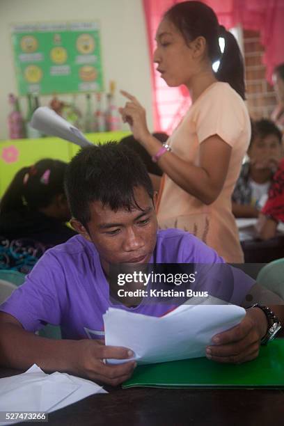 Students at work in Hinigaran high school. Quidan-Kaisahan is a charity working in Negros Occidental in the Philippines. Their aim is to keep...