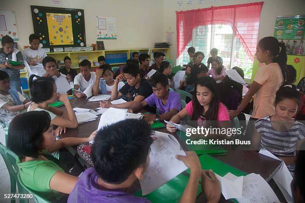 Students at work in Hinigaran high school. Quidan-Kaisahan is a charity working in Negros Occidental in the Philippines. Their aim is to keep...