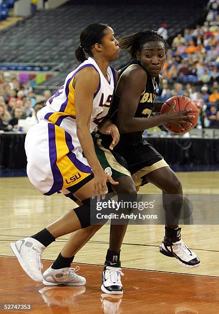 Sophia Young of the Baylor Lady Bears is defended by Wendlyn Jones of the Louisiana State Lady Tigers in the Semifinal game of the Women's NCAA...