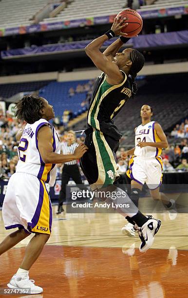 Chelsea Whitaker of the Baylor Lady Bears shoots over Temeka Johnson of the Louisiana State Lady Tigers in the Semifinal game of the Women's NCAA...