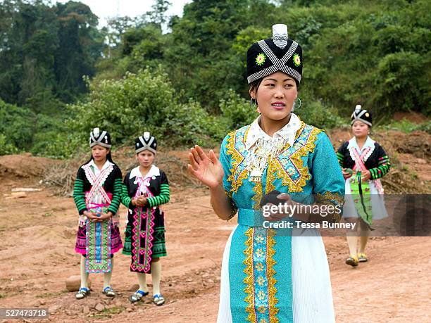 White Hmong men and women playing the ball throwing game of �pov pob' at Ban Hauywai Hmong New Year festival, Phongsaly province, Lao PDR. �Pov pob'...