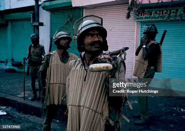Armed police patroling Sadar bazar in Chadni Chowk Delhi after Hindu and Moslem groups clashed in riots following an inflamatory speech by Hindu...