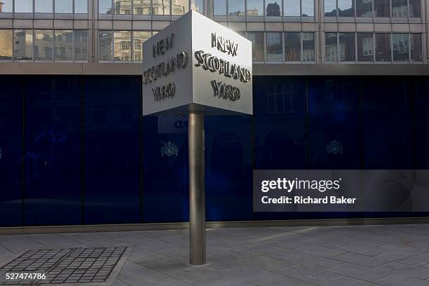 The Metropolitan Police's famous revolving sign their headquarters at New Scotland Yard in Westminster, London. Scotland Yard is a metonym for the...