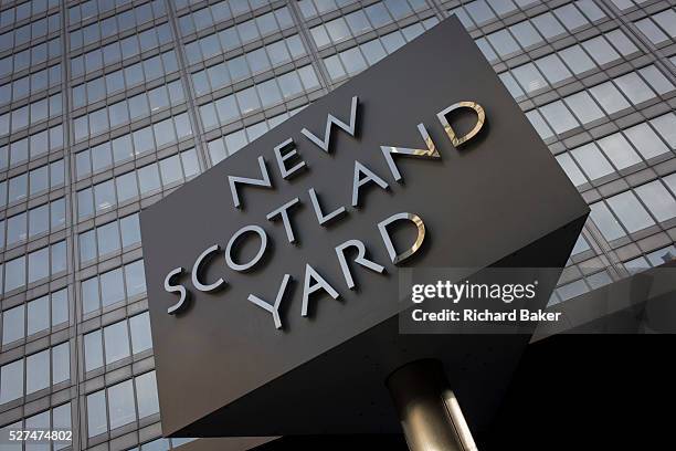 The Metropolitan Police's revolving sign their headquarters at New Scotland Yard in Westminster, London. Scotland Yard is a metonym for the...