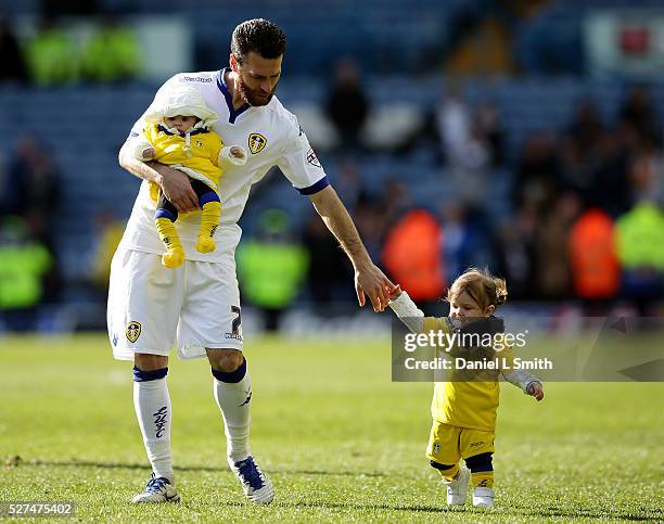 Mirco Antenucci of Leeds United FC holds is daughters hand thanks the fans after their Sky Bet Championship match between Leeds United and Charlton...
