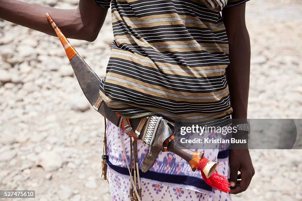 A Young Afra Man Shows Of His Traditional Knife Called Gile In Afar a-young-afra-man-shows-of-his-traditional-knife-called-gile-in-afar