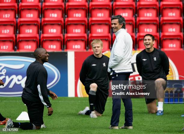 Chelsea manager, Jose Mourinho, shares a joke with his players during a training session ahead of the Champions League Semi Final Second Leg match...