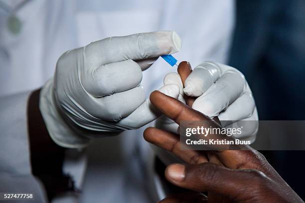 Quick prick to the finger to draw blood to do a HIV speed test. EVA provide HCT in three rural communities near Makurdi in Benue state. Benue state...