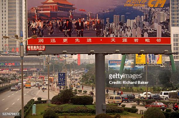 Giant billboard describes the more traditional China - when the main mode of transport was the bicycle and Hong Kong was still a British colony. The...