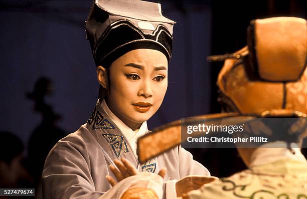 Zhang Lin, 23 leading Yue opera performer from the Xiao Bai Hua Shaoxing Opera Troupe during a performance in a rural village close to Shaoxing City,...