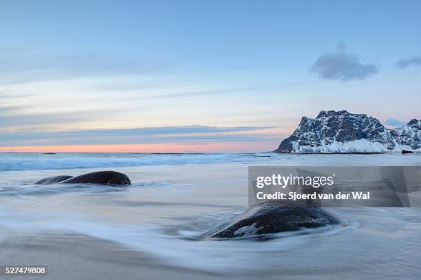 utakleiv beach in the lofoten archipel in norway at the end of a winter day - sjoerd van der wal stock pictures, royalty-free photos & images