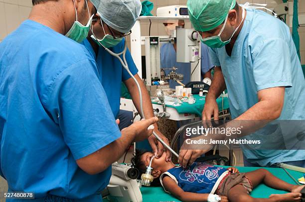 India, Bihar. Mastichak. Akhand Jyoti Eye Hospital. Cataract operation on 2 year old Kusi Kumari, who has had a general anaesthetic.