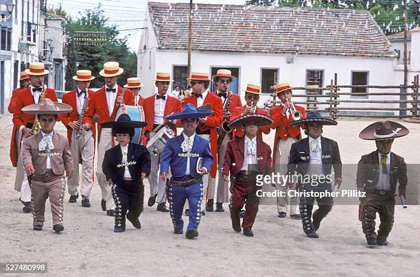 The dwarf troupe of "torero" bullfighter Guillermo Gomez walk through the town of Cienpozuelo to generate interest in the afternoon bullfights at the...