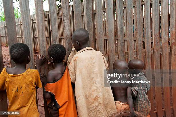 Central African Republic. August 2012. Batalimo camp for refugees from the Democratic Republic of Congo. Young boys listening to a film being shown...