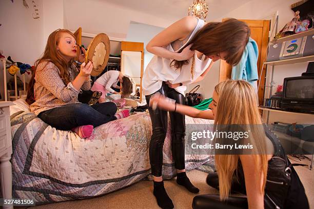 Four girls getting ready for an 18th birtday party for Julia Cummings and Rebecca Stone in the bedroom of Julia's sister Katy. The girls names are...