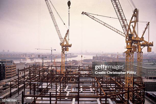 After the old Canary Wharf was demolished, cranes can be seen across the Docklands in its process of redevelopment, seen in the foreground the...