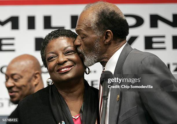 District of Columbia Council member Marion Barry kisses his wife Cora Masters Barry during a news conference to discuss the 10th anniversary of the...