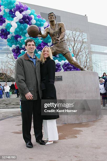 John Stockton and his wife, Nada, pose for a photo at the unveiling of a 9-foot bronze statue of Stockton, a former Utah Jazz point guard, outside...