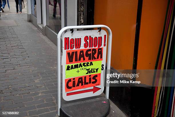 Viagra and Cialis for sale outside a sex shop in Soho, London. Both prescription drugs to counteract erectile disfunction, they are also widely...