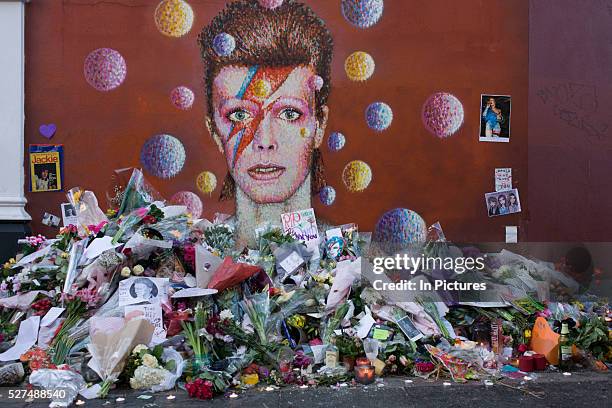 London 12th January 2016: Fans of iconic English music artist David Bowie who died from Cancer at the age of 69 on Sunday 10th January, gather to pay...