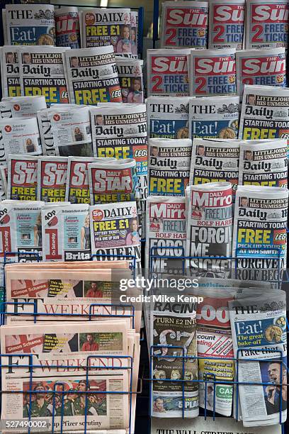 Stand of tabloid newspapers at a newsagents. London, UK. The Sun, ther Daily Mail, The Star, Daily Mirror predominantly.