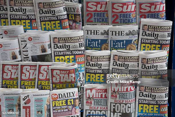 Stand of tabloid newspapers at a newsagents. London, UK. The Sun, ther Daily Mail, The Star, Daily Mirror predominantly.