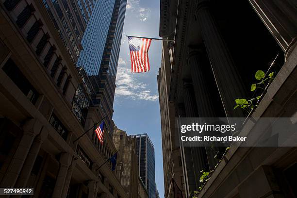 Tall, wide view of banking and financial institutions on Wall Street, Lower Manhattan, New York City. This famous street symbolises the US economy....