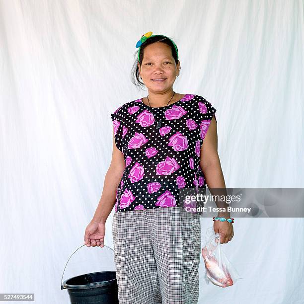 Maribel Beloria , fish saleswoman, Pooc, Bantayan Island, The Philippines. Every morning at 7 am fisherwomen meet fishermen as they return from the...