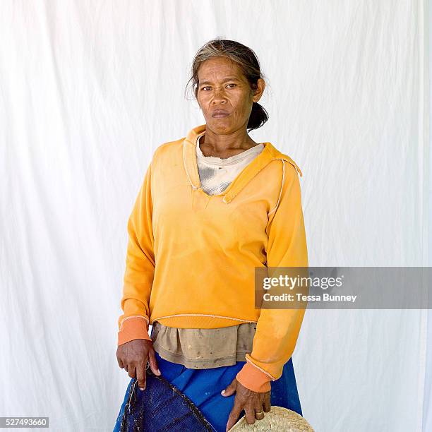 Marie Clar Labtik , shell collector, Pooc, Bantayan Island, The Philippines. Marie Clar uses the shells for making necklaces and other products for...