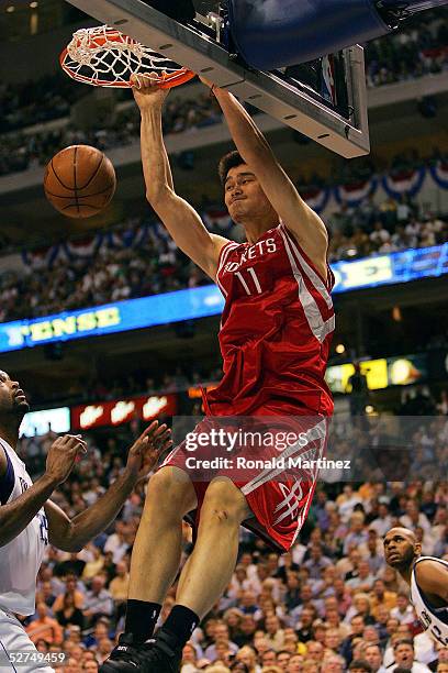 Yao Ming of the Houston Rockets slams the ball against the Dallas Mavericks in Game five of the Western Conference Quarterfinals during the 2005 NBA...