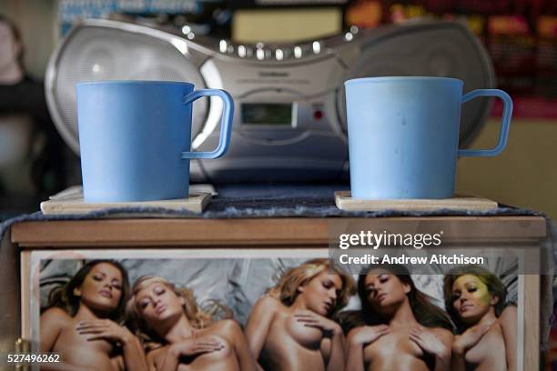 Plastic cups issued to prisoners and a picture of semi-nude women inside an 'enhanced' prsoners room on H wing at the Young Offenders Institution in...