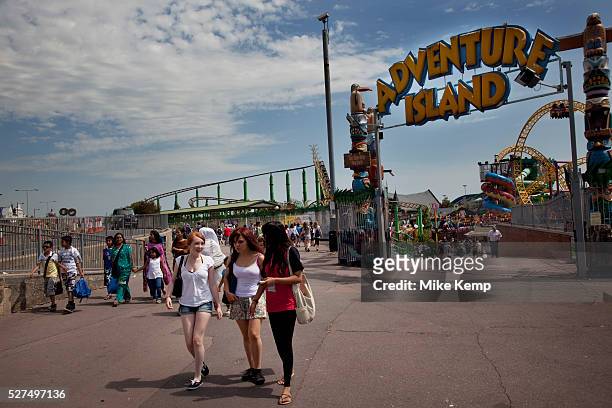 People enjoying the various rides at Adventure Island Funfair at Southend-on-sea, Essex. The town could be described as run down as while there are...