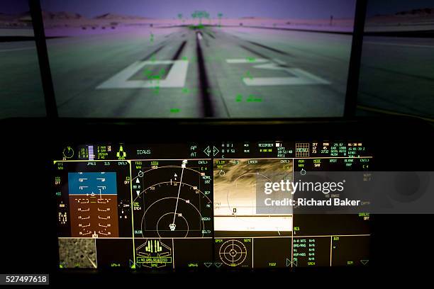 Glowing cockpit instrumentation of a Lockheed Martin F-35 Lightning II stealth fighter. The F-35 Lightning II is a fifth-generation, single-seat,...