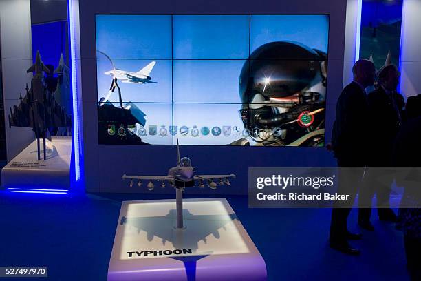 Visitors admire the features of the BAE Systems Typhoon jet fighter presentation model, exhibited at the Farnborough Air Show, England. The Typhoon...